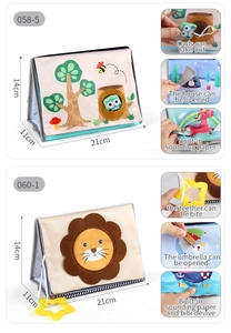 Detail view of baby cloth book with teething star toy and interactive sound components