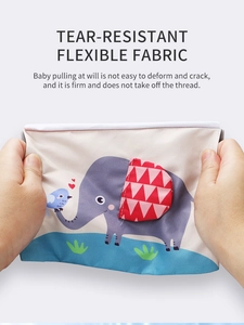 Detail showing tear-resistant flexible fabric of baby cloth book with cartoon elephant