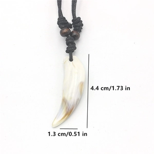 Faux wolf tooth pendant necklace with acrylic shell texture and black braided rope