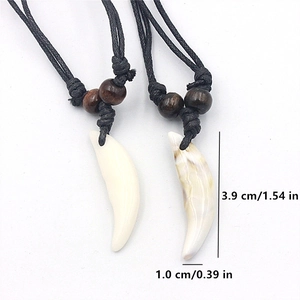 Set of two acrylic faux wolf tooth necklaces with black cord and brown beads detail