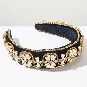 Detailed view of the luxury wide velvet headband with sparkling crystals in floral pattern