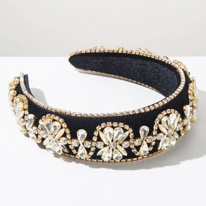 Close-up of luxury black velvet headband featuring baroque colorful crystal patterns