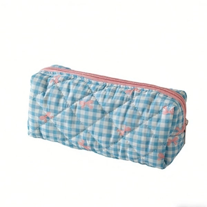 Quilted blue checkered makeup bag with pink bow pattern and zipper for travel