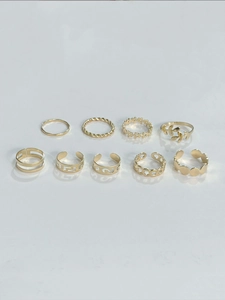 Detailed set of nine bohemian style gold metal rings with hollow and braided patterns