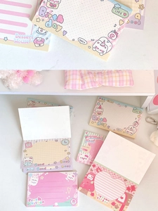 Detail of cute cat themed sticky notes with peach and autumn kitten illustrations