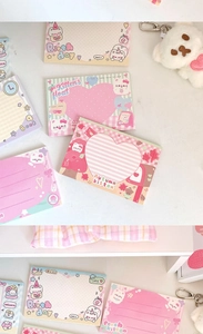 Multiple cute cartoon cat memo pads in pastel colors for journaling and notes