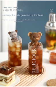 Macro shot of 3D bear ice cubes with detailed fur texture in a glass of coffee