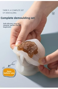 Detail showing the flexible silicone mold releasing a 3D bear ice cube with ease