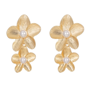 Elegant gold double flower earrings with brushed metal texture and pearl center