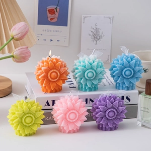 Macro shot of colorful blooming dahlia scented candles set for creative home decor
