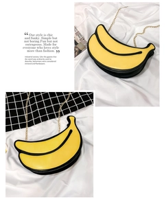 Creative banana-shaped crossbody bag with yellow leather and gold chain detail