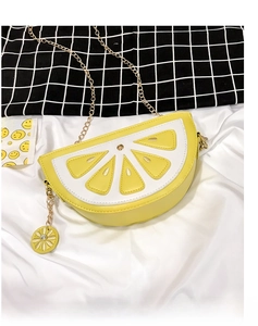 Detailed top view of lemon slice crossbody bag with gold chain and PU leather texture