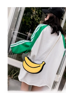 Creative banana-shaped crossbody bag with gold chain strap and textured yellow finish