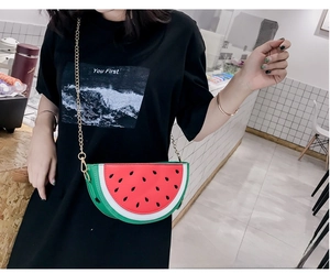 Detail of watermelon shaped crossbody bag featuring red and green PU leather and gold chain