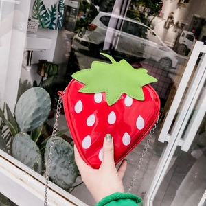 Funny strawberry shaped crossbody chain bag with red glossy finish and green leaves