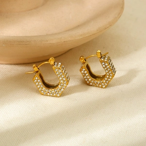 Chic 18K gold plated geometric earrings with pavé set crystals on a textured background