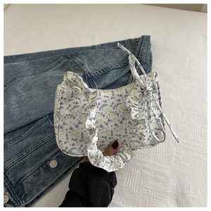 Detail of floral tote bag featuring purple lavender prints and stylish ruffle trim