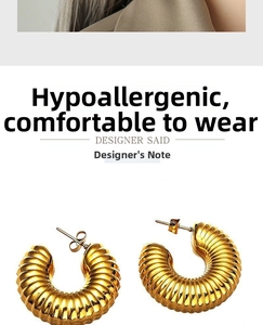 Detail of gold croissant hoop earrings featuring textured ridges and hypoallergenic needles