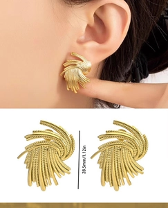 Detailed view of 28.5mm gold artistic fan earrings with textured layered metal design