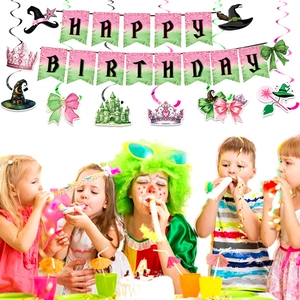 Detail of Happy Birthday banner and wizard-themed party decorations in pink and green