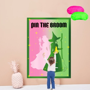 Macro view of a child playing 'Pin the Broom' game poster with colorful eye masks