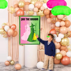 Kids party scene with Pin the Broom game poster and decorative balloon arch background