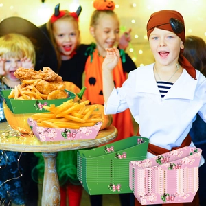 Close-up of disposable paper food trays with bow patterns for birthday party snack serving
