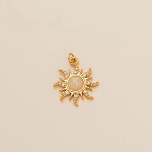 Detailed macro view of golden sun pendant with white opal and glittering zircon accents