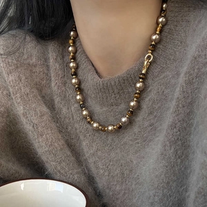Tiger eye and pearl beaded necklace on gray sweater, vintage autumn jewelry for women