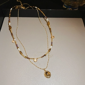 Double-layered necklace with tiger eye stone pendant and colorful beaded chain necklace