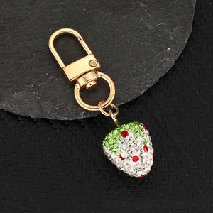 Handmade 3D strawberry keychain with sparkling rhinestones and gold metal hardware