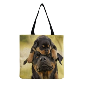 Close-up of canvas tote bag featuring realistic Rottweiler and puppy prints