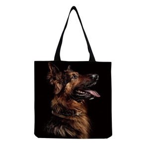 Detailed realistic German Shepherd portrait print on large black canvas tote bag surface