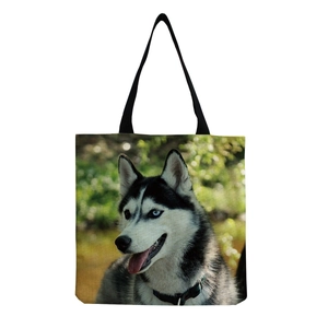 Close-up of husky print with heterochromia eyes on a canvas tote bag with black straps