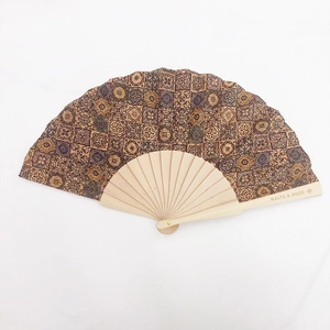Detail of vintage Portuguese cork folding fan with Malta & Gozo tile pattern engraving