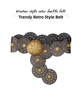 Detail of western retro belt showing hollow leather circles and antique sunburst buckle