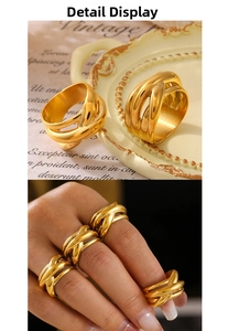 Detail of wide multi-layered interlaced titanium steel ring with 18k gold plating