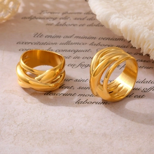 Set of two gold-plated titanium steel rings featuring irregular intertwined line designs