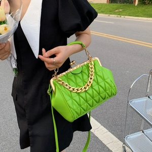 Bright green quilted crossbody bag with gold chain and vintage frame closure for women