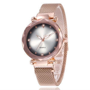 Detailed close-up of a women's quartz watch with a cat-eye dial and rose gold Milanese band