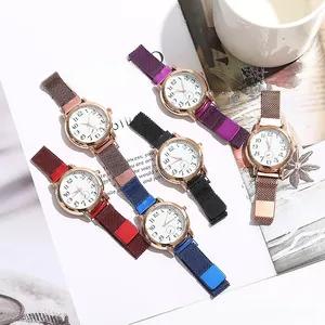 Detail of colorful women's quartz watches with magnetic mesh straps and cat eye dials