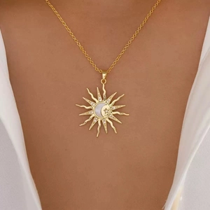 Elegant gold celestial sun and moon necklace with star inlay worn by a female model