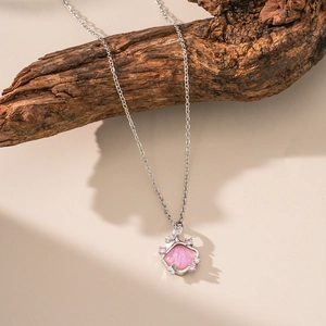 Pink pearlized seashell pendant necklace with sparkling crystals on silver chain