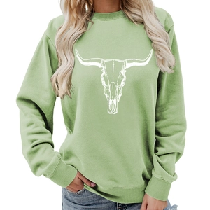 Avocado green crewneck sweatshirt featuring a white western bull skull graphic print