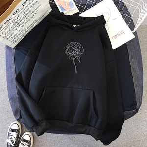Detailed view of black oversized hoodie with white floral line art and kangaroo pocket