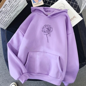 Lavender oversized hoodie with minimalist floral print on a stylish flat lay background