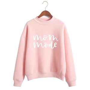 Pink Mom Mode sweatshirt with crew neck and ribbed cuffs on a wooden hanger