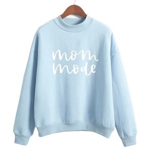 Close-up of mom mode print on light blue cotton sweatshirt with ribbed cuff details