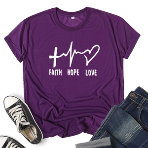 Detail of purple Faith Hope Love T-shirt paired with ripped jeans and sneakers