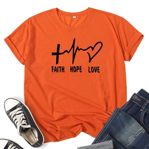 Flat lay of an orange Faith Hope Love printed T-shirt with jeans and canvas sneakers